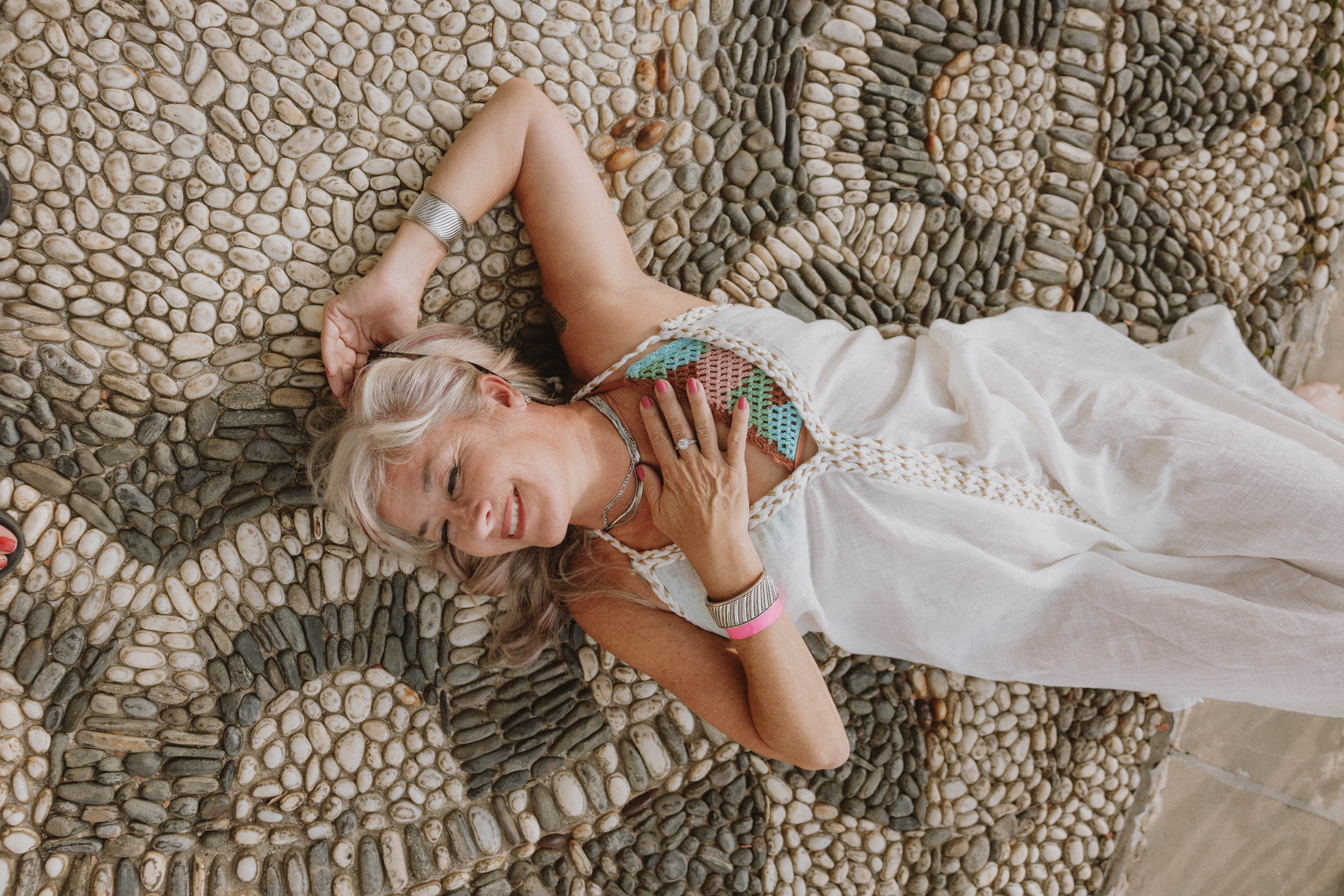 Dr. Courtni Hale, PhD resting on mosaic tiles